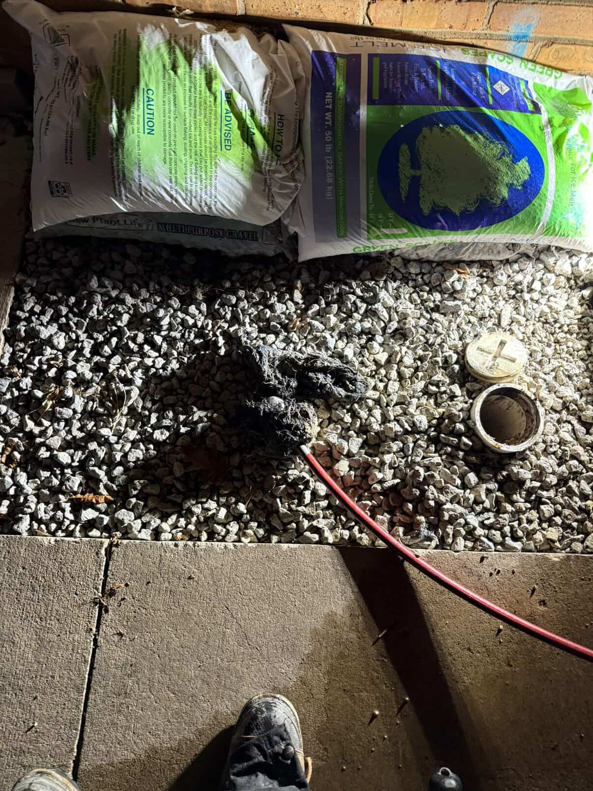 Black drain debris removed during a hydro jetting service